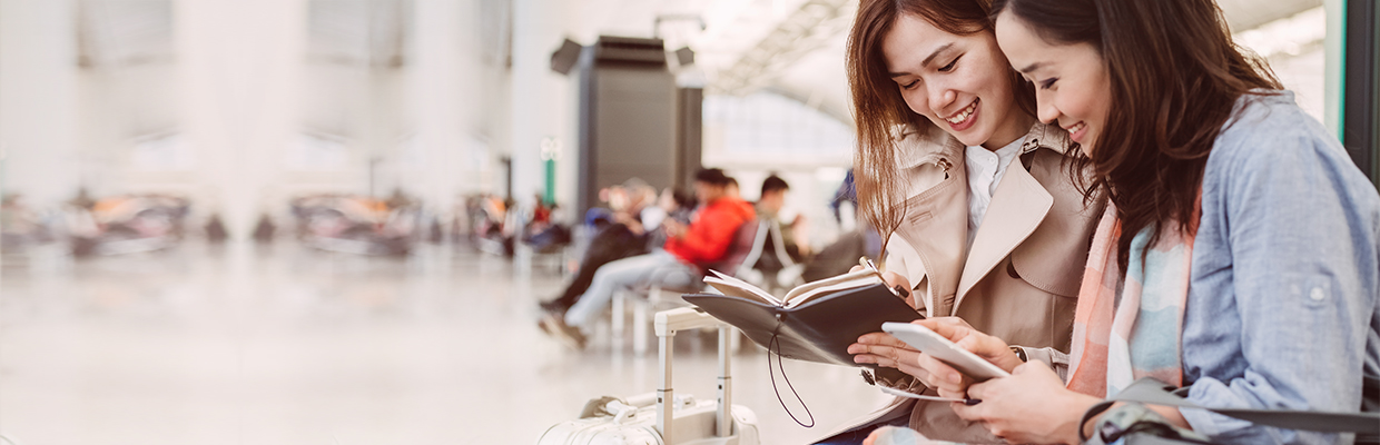 Two girls at airport; Image used for HSBC credit card benefits page.